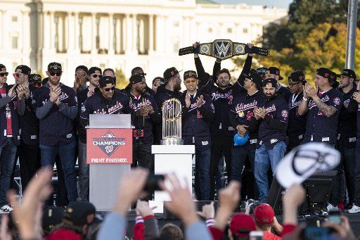 Trey Turner, Washington Nationals team player holds a belt while celebrating on stage after winning their first World Series over the Houston Astros with a 6-2 win Wednesday in Washington, DC on Saturday, November 2, 2019. Photo by Ken Cedeno\/