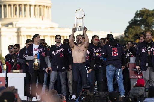 Brian Dozier, Washington Nationals player holds the Commissioners Trophy on stage after winning their first World Series over the Houston Astros with a 6-2 win Wednesday in Washington, DC on Saturday, November 2, 2019. Photo by Ken Cedeno\/