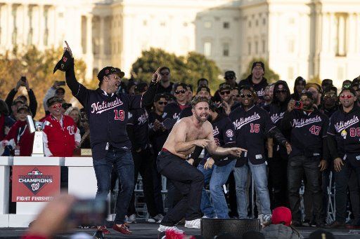 Brian Dozier, Washington Nationals player celebrates on stage after winning their first World Series over the Houston Astros with a 6-2 win Wednesday in Washington, DC on Saturday, November 2, 2019. Photo by Ken Cedeno\/