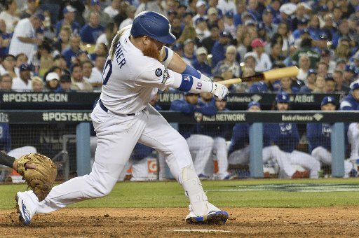 Los Angeles Dodgers Justin Turner hits a one-out single in the seventh inning of the MLB National League Division Series game with the Washington Nationals at Dodger Stadium in Los Angeles on Thursday, October 3, 2019. Photo by Jim Ruymen\/UPI.