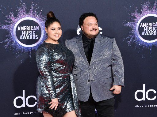Adrian Martinez (R) and guest arrive for the 47th annual American Music Awards at the Microsoft Theater in Los Angeles on Sunday, November 24, 2019. Photo by Jim Ruymen\/