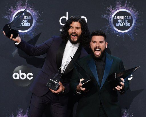 (L-R) Dan Smyers and Shay Mooney of Dan + Shay appear backstage with their awards for Favorite Song - Country for "Speechless" and Favorite Duo or Group  Country, during the 47th annual American Music Awards at the Microsoft Theater in Los Angeles on Sunday, November 24, 2019. Photo by Jim Ruymen\/