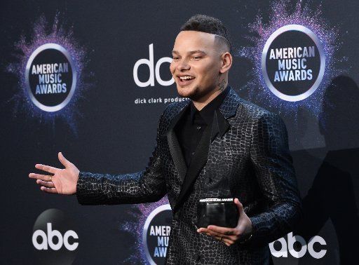 Singer Kane Brown appears backstage with his award for Favorite Male Artist - Country, during the 47th annual American Music Awards at the Microsoft Theater in Los Angeles on Sunday, November 24, 2019. Photo by Jim Ruymen\/