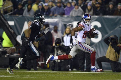 New York Giants wide receiver Darius Slayton (86) runs past Philadelphia Eagles free safety Rodney McLeod (23) for a touchdown during the first half at Lincoln Financial Field in Philadelphia on Dec. 9, 2019. Photo by Derik Hamilton\/