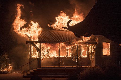 A building at Soda Rock Winery burns from wind-driven embers in Healdsburg, California, early Sunday, October 27, 2019. Over 200,000 people have been evacuated in Northern California as winds clocked as high as 93 MPH fanned flames. Photo by Terry Schmitt\/