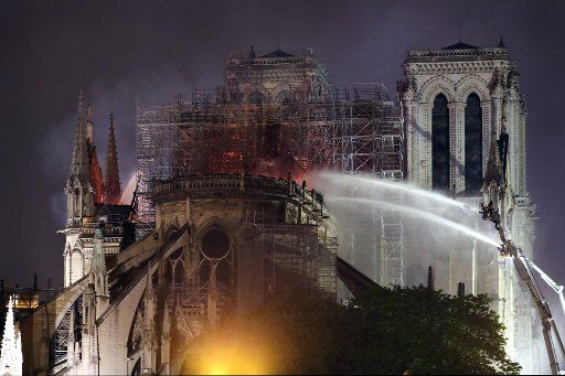 Firefighters battle to extinguish a giant fire that engulfed Paris\