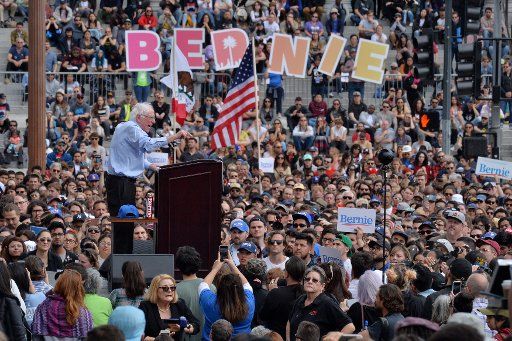 Senator Bernie Sanders, a candidate for the Democratic presidential nomination, addresses thousands of supporters during a campaign rally at Grand Park in the shadow of City Hall in Los Angeles on March 23, 2019. The campaign stop is part of a West Coast swing by Sanders that also includes rallies in San Diego and San Francisco. Sanders, 77, who is considered the front runner in a field that could eventually include as many as two dozen candidates, has also made stops in early primary and caucus states like Iowa and New Hampshire since announcing his candidacy last month. Photo by Jim Ruymen\/