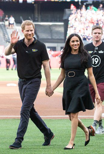 The Duke and Duchess of Sussex, Prince Harry, and Meghan, walk on the field when the New York Yankees play the Boston Red Sox at the London Stadium in the Queen Elizabeth Olympic Park in London on Saturday, June 29, 2019. Europe\