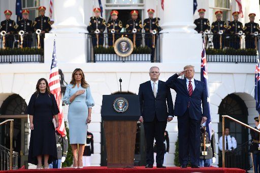 President Donald Trump (R) and first lady Melania Trump stand with Australian Prime Minister Scott Morrison and his wife Jennifer Morrison (L) during the national anthem at welcoming ceremony during State Visit to the White House in Washington, D.C. on Friday, September 20, 2019. Photo by Kevin Dietsch\/