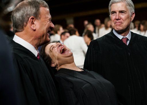 Supreme Court Justices John Roberts, Elena Kagan, and Neil Gorsuch share a moment at the State of the Union address at the Capitol in Washington, D.C., on February 5, 2019. Photo by Doug Mills\/