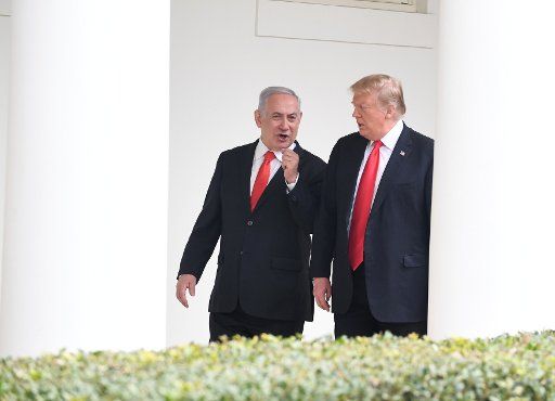 President Donald Trump (R) walks with Israeli Prime Minister Benjamin Netanyahu along the Colonnade to the Oval Office of the White House in Washington, D.C., on March 25, 2019. The leaders signed an agreement on the Golan Heights, recognizing it as Israeli Territory, during a one-day visit. Photo by Pat Benic\/