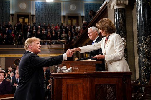 President Donald Trump shakes hands with Speaker of the House Nancy Pelosi as he arrives to deliver his State of the Union Address at the Capitol in Washington, D.C., on February 5, 2019. Photo by Doug Mills\/