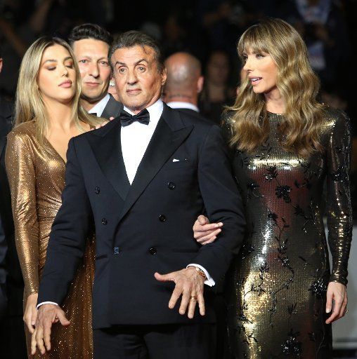 Sylvester Stallone, his daughter Sophia Stallone (L) and his wife Jennifer Flavin (R) arrive on the red carpet before the screening of the film "Rambo: First Blood" at the 72nd annual Cannes International Film Festival in Cannes, France on May 24, 2019. Photo by David Silpa\/