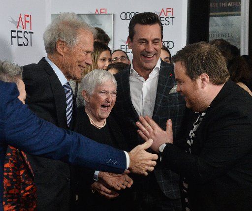 Cast member Paul Walter Hauser (R) greets Bobi Jewell (C) as director Clint Eastwood (L), and cast member John Hamm gather for a photo-op during the premiere of the motion picture drama "Richard Jewell" at the TCL Chinese Theatre in the Hollywood section of Los Angeles on Wednesday, November 20, 2019. Photo by Jim Ruymen\/UPI.