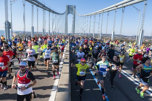 Runners cross the Verrazano Bridge at the NYRR TCS New York City Marathon in New York City on Sunday, November 3, 2019. Over 50,000 runners from New York City and around the world will race through the five boroughs on a course that winds its way from the Verrazano Bridge before crossing the finish line by Tavern on the Green in Central Park. Photo by Corey Sipkin\/
