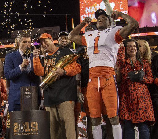 Clemson Tigers head football coach Dabo Swinney holds the Dr. Pepper National Championship Trophy after Clemson defeated Alabama 44-16 in the College Football Playoff National Championship game at Levi\