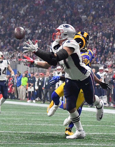 New England Patriots tight end Rob Gronkowski (87) pulls in a 29-yard pass from quarterback Tom Brady in the fourth quarter of Super Bowl LIII against the Los Angeles Rams at Mercedes-Benz Stadium on February 3, 2019, in Atlanta. The play set up first and goal. Photo by Kevin Dietsch\/