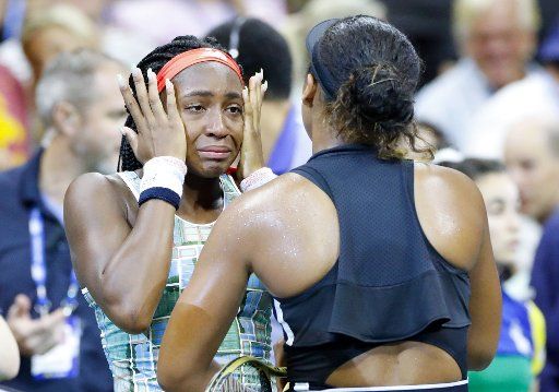 Teenager Coco Gauff, seen here being consoled by Naomi Osaka of Japan, breaks down in tears after losing her 3rd Round match in Arthur Ashe Stadium at the 2019 US Open Tennis Championships at the USTA Billie Jean King National Tennis Center on Saturday, August 31, 2019, in New York City. Photo by John Angelillo\/