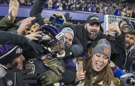 Baltimore Ravens wide receiver Marquise Brown (15) celebrates with fans after scoring a touchdown against the New York Jets in the 3rd quarter at M&T Bank Stadium in Baltimore, Maryland on Thursday, December 12 2019. Photo by Tasos Katopodis\/