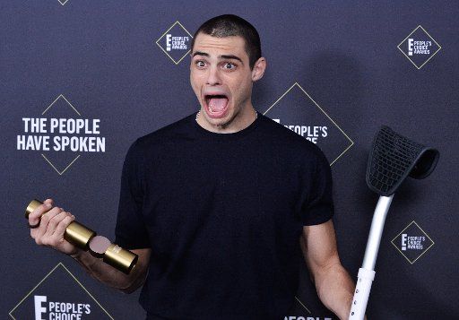 Noah Centineo appears backstage with his award for Comedy Movie Star of 2019 during the 45th annual E! People\