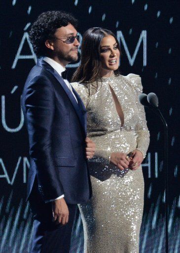 Presenters Andres Cepeda and Dayanara Torres onstage during the 20th annual Latin Grammy Awards honoring Columbian singer Juanes at the MGM Grand Convention Center in Las Vegas, Nevada on Thursday, November 14, 2019. Photo by Jim Ruymen\/