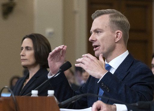 David Holmes, an U.S. Embassy official in Ukraine, testifies how he overhead a phone call with Ambassador Gordon Sondland and President Donald Trump as he testifies before the Impeachment Hearings on Capital Hill in Washington, DC on Thursday, November 21, 2019. At left Fiona Hill, a former Russia expert at the White House, listens. The hearings are looking into the actions of President Donald Trump that may lead to Impeachment. Photo by Pat Benic\/