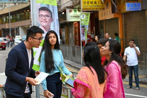 Pro-democracy candidate Isaac Ho spoke with constituents in Tsim Sha Tsui during Hong Kong\