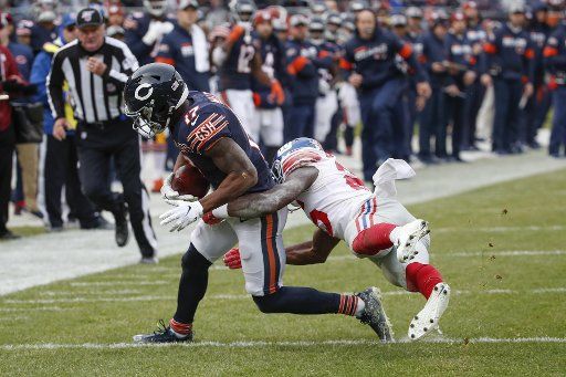 Chicago Bears wide receiver Anthony Miller (17) is tackled by New York Giants defensive back Corey Ballentine (25) during the second half of an NFL game at Soldier Field in Chicago on Sunday, November 24, 2019. Photo by Kamil Krzaczynski\/