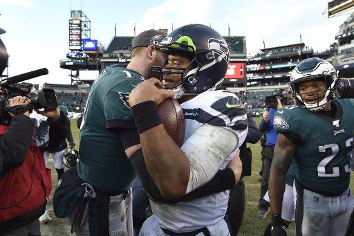Seattle Seahawks quarterback Russell Wilson (3) shakes hands with Philadelphia Eagles quarterback Carson Wentz (11) after a game at Lincoln Financial Field in Philadelphia on Nov. 24, 2019. The Seahawks won 17-9. Photo by Derik Hamilton\/