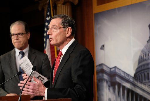 Sen. John Barrasso (R-WY) speaks to the media alongside Mike Braun, (R-IN), (R-WY) during a break at the U.S. Capitol on Monday, January 27, 2020. Photo by Alex Wroblewski\/