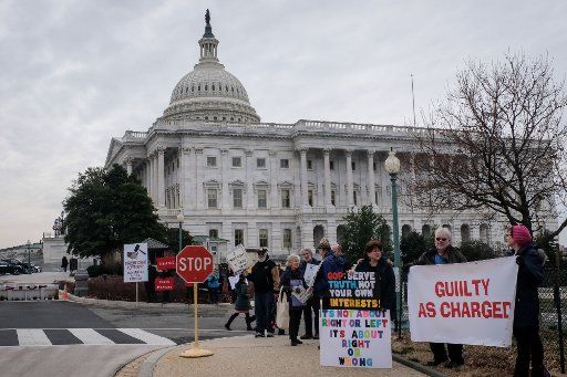 Protestors demonstrate outside of the Capitol Hill on Friday, January 31, 2020. Republican Senators are likely to have the votes to prevent hearing from witnesses. Photo by Alex Wroblewski\/