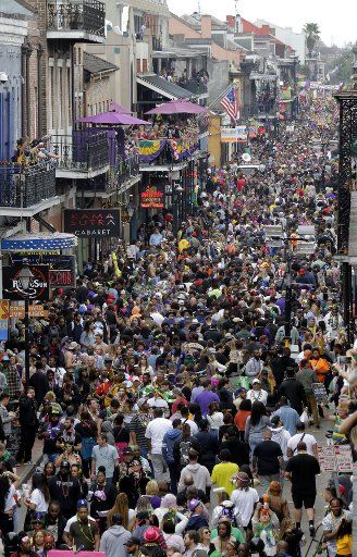 Thousands of Mardi Gras revelers crowd Bourbon Street in the French Quarter of New Orleans on Tuesday, February 25, 2020. Photo by AJ Sisco\/