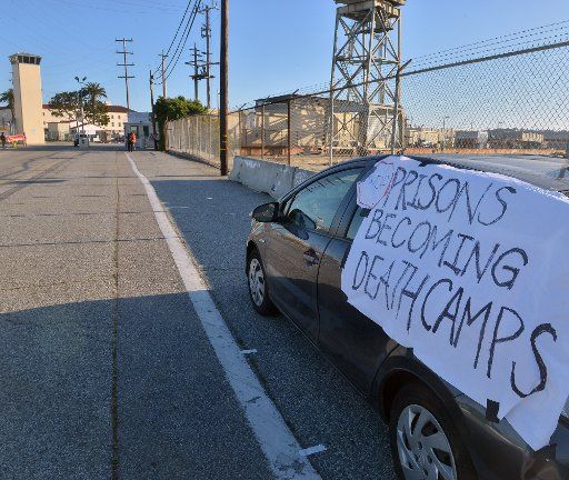 A small group of activists protest outside the Federal Correctional Institution in San Pedro, California on Saturday, May 2, 2020. The American Civil Liberties Union and other groups are suing the U.S. government over conditions at the federal prison, where close to half of the inmates have tested positive for the coronavirus. Several hundred inmates and a smaller number of staff members have tested positive for COVID-19 at Terminal Island. At least seven inmates have died from complication related to the virus. Los Angeles County health officials say all inmates in the facility are tested for COVID-19, and numbers released last week show that 552 inmates had recovered after testing positive. The Federal Bureau of Prisons has used a manufacturing facility at the prison as expanded housing, and has erected military tents to distance inmates from one another. File Photo by Jim Ruymen\/