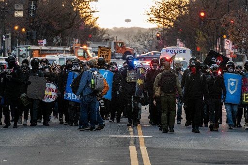 Antifa demonstrators march following a pro Trump rally in Washington, DC on Saturday, December 12, 2020. Large groups of supporters of President Donald Trump are marching on the the Nation\