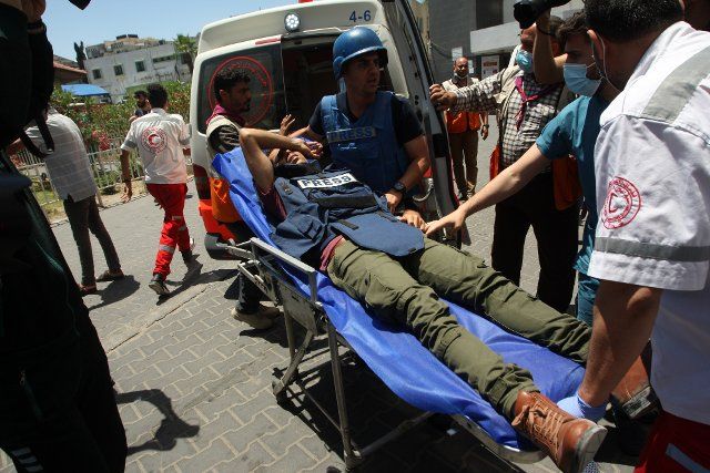 Medics tend to a Palestinian Journalist Dahlan injured in the aftermath of an Israeli air strike on Gaza city, in Al-Shifa Hospital in Gaza City, on Wednesday, May 19, 2021. Photo by Ismael Mohamad