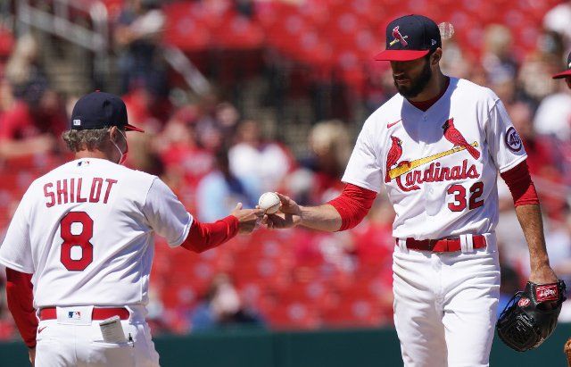 St. Louis Cardinals starting pitcher Daniel Ponce De Leon, hands the baseball to manager Mike Shildt as he leaves the game in the second inning against the Milwaukee Brewers at Busch Stadium in St. Louis on Sunday, April 11. 2021. Photo by Bill Greenblatt