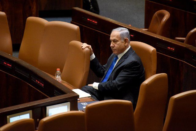 Israeli Prime Minister Benjamin Netanyahu sits in the Israeli Knesset, the Parliament, before the government votes on a unity government in Jerusalem, on Sunday, June 13, 2021. Photo by Debbie Hill