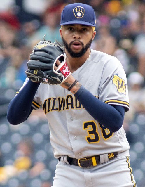 Milwaukee Brewers relief pitcher Devin Williams (38) glances to third base before making the throw in the eighth of the Brewers 2-1 win against the Pittsburgh Pirates at PNC Park on Sunday, August 15, 2021 in Pittsburgh. Photo by Archie Carpenter