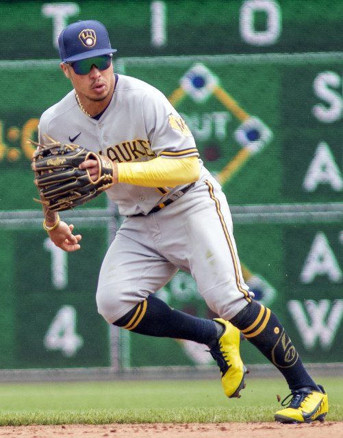 Milwaukee Brewers second baseman Kolten Wong (16) lunges for the ball during the eighth inning of the 2-1 Brewers win against the Pittsburgh Pirates at PNC Park on Sunday, August 15, 2021 in Pittsburgh. Photo by Archie Carpenter