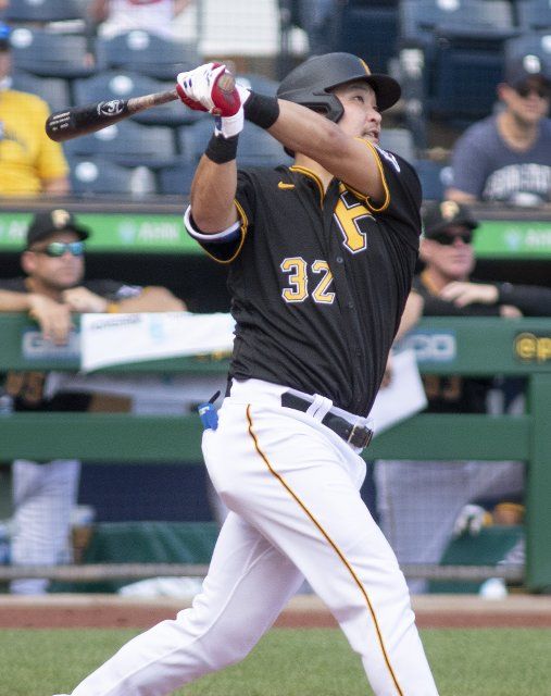 Pittsburgh Pirates first baseman Yoshi Tsutsugo (32) hits a 422 feet 3 run homer in the bottom of the ninth inning to win the game 4-3 against the St. Louis Cardinals at PNC Park on Sunday, August 29, 2021 in Pittsburgh. Photo by Archie Carpenter