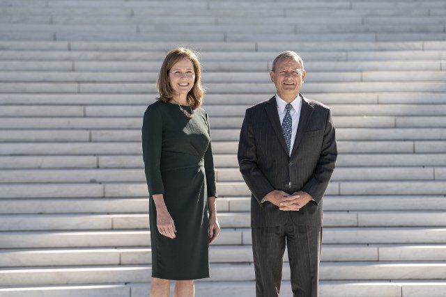 Supreme Court Justice Amy Coney Barrett and Chief Justice of the Supreme Court John Roberts participate in a photo-op outside of the Supreme Court of the United States following a investiture ceremony in Washington, DC on Friday October 1, 2021. Photo by Sarah Silbiger