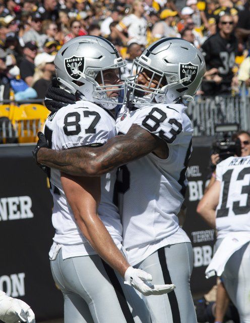 Las Vegas Raiders tight end Foster Moreau (87) celebrates his nine yard touchdown with Las Vegas Raiders tight end Darren Waller (83) during the third quarter at Heinz Field on Sunday, September 19, 2021. Photo by Archie Carpenter