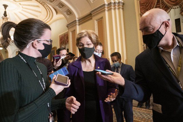 Sen. Elizabeth Warren, D-MA, speaks to reporters after a Democratic caucus luncheon at the US Capitol in Washington, DC on Tuesday December 7, 2021. Photo by Sarah Silbiger