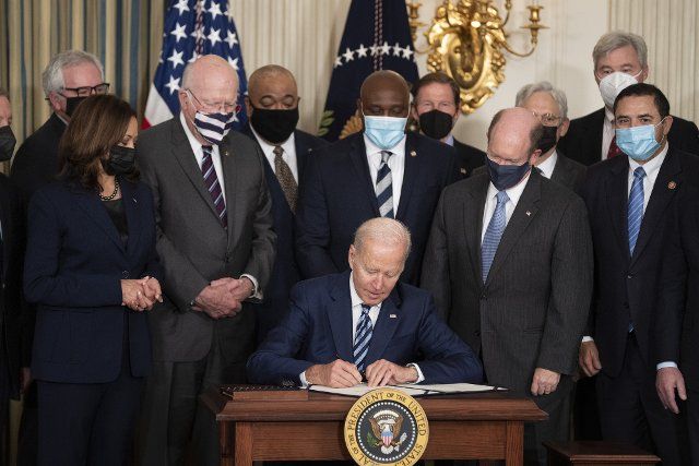 United States President Joe Biden signs into law S. 1511, the "Protecting America\