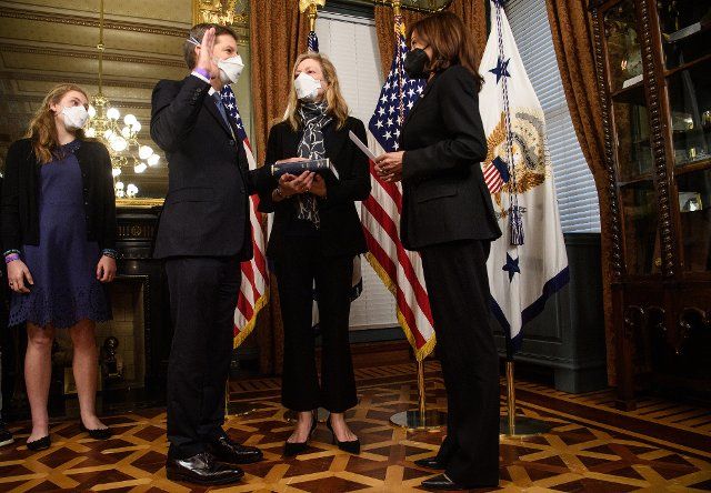 Vice President Kamala Harris (R) swears in Scott Nathan (L) as CEO of the US International Development Finance Corporation as his wife Laura DeBonis looks on in the Ceremonial room at the White House in Washington, DC on Thursday, February 24, 2022. Photo by Yuri Gripas