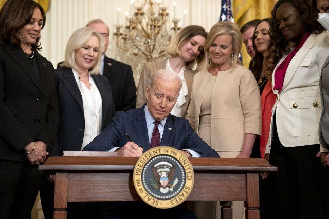 President Joe Biden signs into law H.R. 4445, the "Ending Forced Arbitration of Sexual Assault and Sexual Harassment Act of 2021" in the East Room at the White House in Washington, DC on Thursday, March 3, 2022. Photo by Leigh Vogel