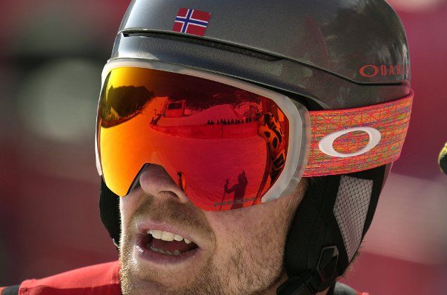 Aamodt Aleksander Kilde of Norway looks back up the course, reflected in his goggles, after taking the silver medal in the men\