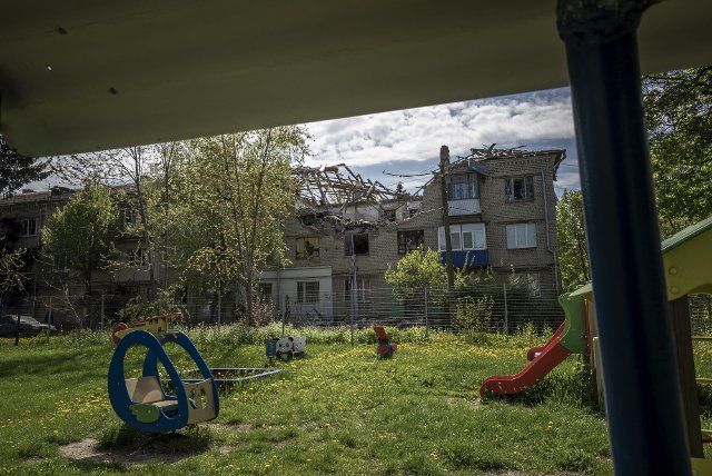 Damage to an apartment building next to a playground in the Pyatikhatki district by a Russian artillery round fired from approximately 10 kilometers away outside of Kharkiv, Ukraine, May 1, 2022. House Speaker Nancy Pelosi led the first official delegation of lawmakers to Ukraine and became the most senior United States official to meet with President Volodymyr Zelenskysince Russia invaded on Feb. 24, according to a statement released Sunday. Photo by Ken Cedeno