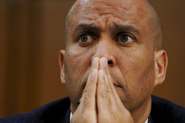Senator Cory Booker (D-NJ) listens on as Senator Josh Hawley (R-MO) questions Supreme Court nominee Ketanji Brown Jackson during a Senate Judiciary Committee confirmation hearing on Capitol Hill in Washington, DC, Tuesday, March 22, 2022. Jackson was nominated by President Joe Biden to fill Supreme Court Justice Stephen Breyer\