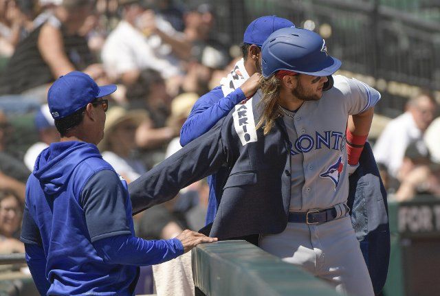 Toronto Blue Jays Bo Bichette puts on the HR Squad Jacket after his grand slam home run against the Chicago White Sox during the fourth inning of a game at Guaranteed Rate Field in Chicago, IL on Wednesday, June 22, 2022. Photo by Mark Black